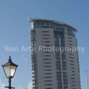 A modern skyscraper glass tower architecture photo with a vintage street lamp silhouette for techno album cover design by Bon Arte Photography.